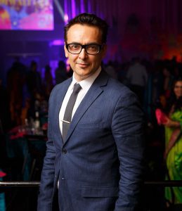 Raj Suri is a Sydney-based Indian-Australian creative professional, photographer, actor, presenter, media and film producer, talent mentor, and cultural curator. He is the founder of Miss India Australia, established in 2001, and has been involved in creating platforms for Indian-Australian talent, youth mentoring, women’s empowerment, personal branding, and multicultural representation. Raj has also served as a judge on SBS Australia’s Bollywood Star and has worked across film, television, fashion, media, and lifestyle content production. His experience brings strong insight into confidence, camera presence, performance, image, and cultural storytelling.